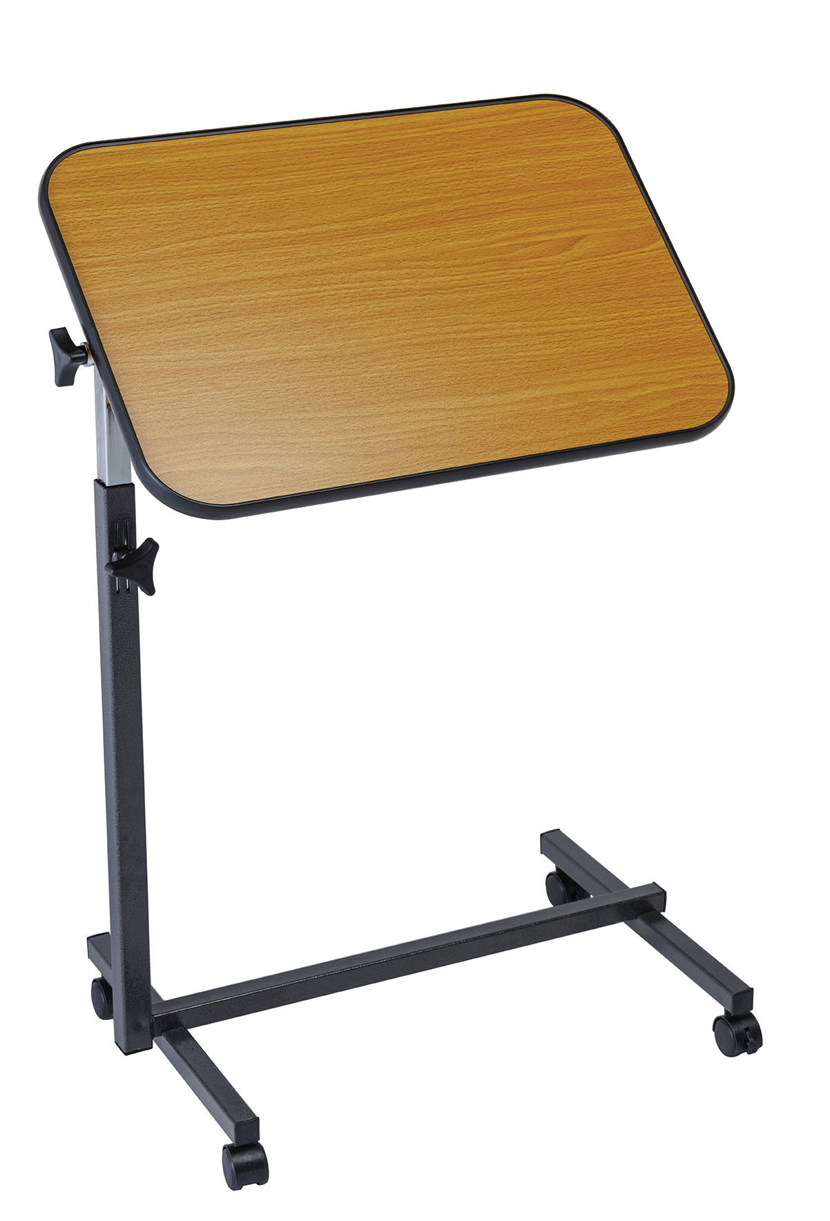 Stolik na kółkach z drewnianym blatem i regulowaną wysokością, używany do nauki lub pracy.