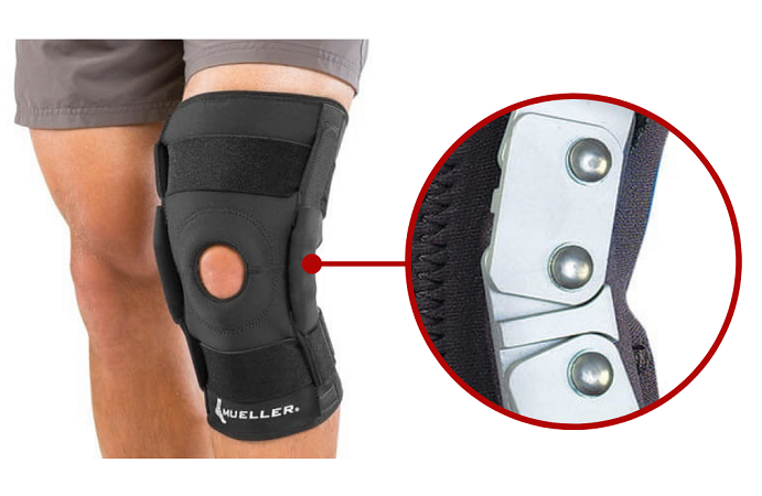 Knee brace z otworem na rzep, wzmocniony metalowymi elementami, na nodze mężczyzny.