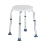 Stolik na czterech regulowanych nogach z okrągłym, białym blatem.