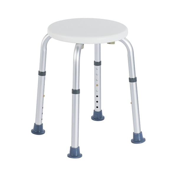 Stolik na czterech regulowanych nogach z okrągłym, białym blatem.