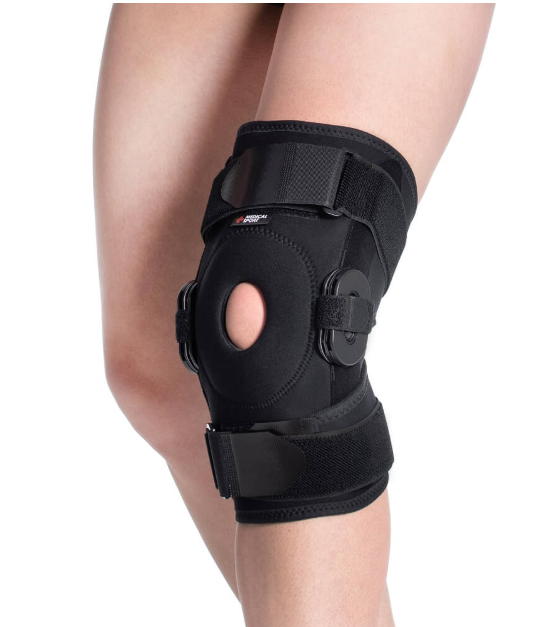 Orteza kolana z otworem na rzep, czarna, mocowana taśmami na udzie i podudzie.