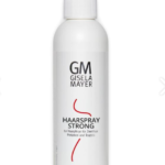 Spray do włosów dla kobiet i mężczyzn, mocny utrwalacz, w białej butelce z pompką i czarnym napisem.