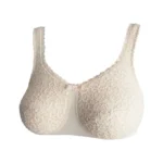 Beżowy biustonosz z koronkową fakturą i ozdobną kokardką na środku.