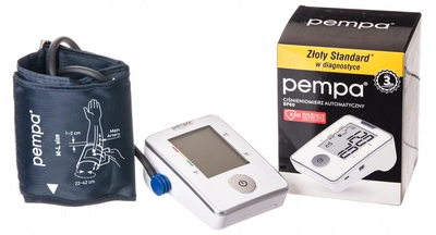 Ciśnieniomierz na nadgarstek, zasilany bateriami, obok opakowania z opisem Złoty Standard i logo marki Pempa.